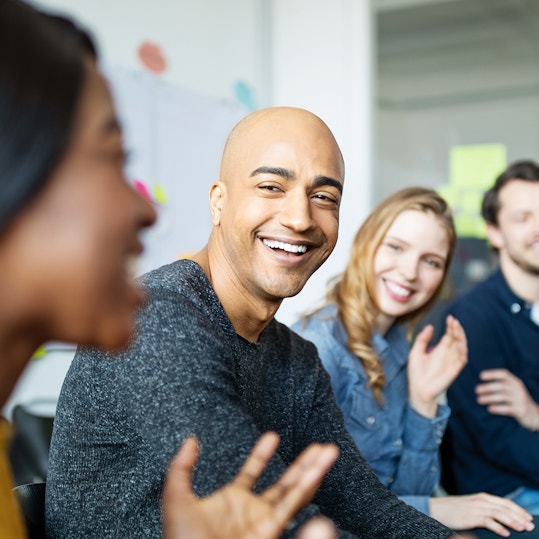 Business team smiling during a meeting