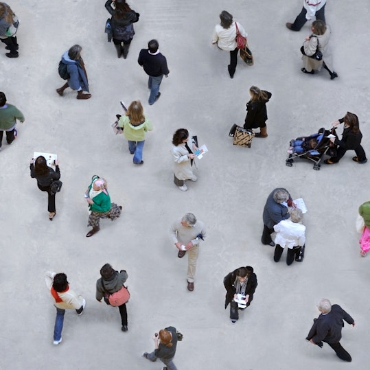 Aerial view of people walking in city