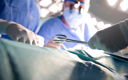 Concentrating surgeons performing operation in operating room