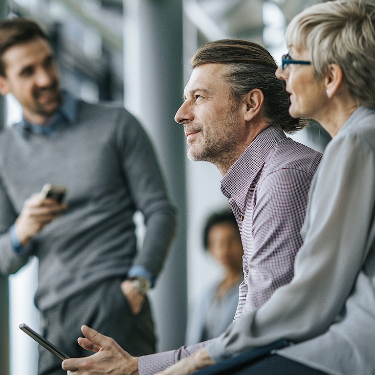 Group of people sat chatting.