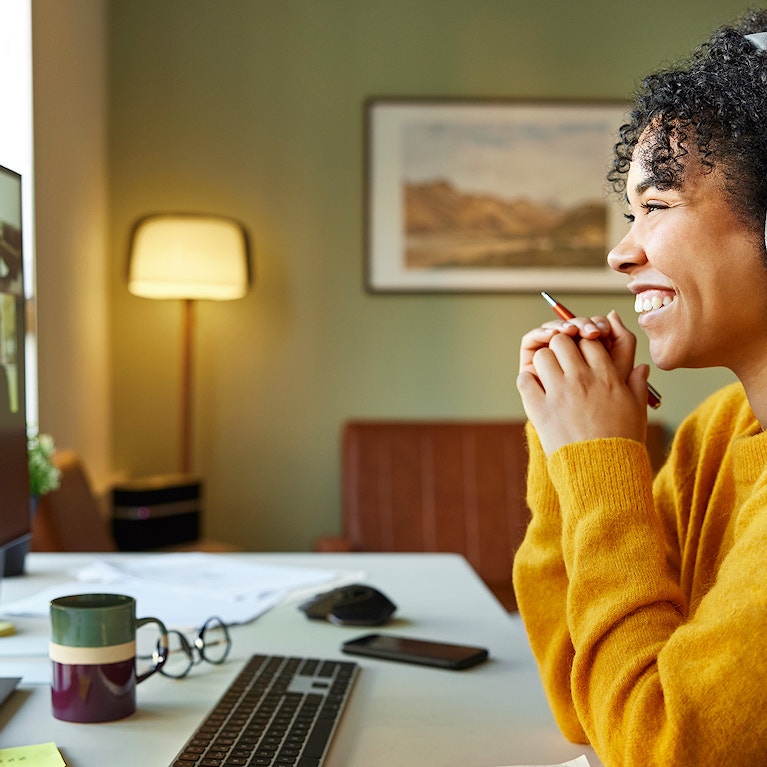 Multiracial colleagues discussing on video call
